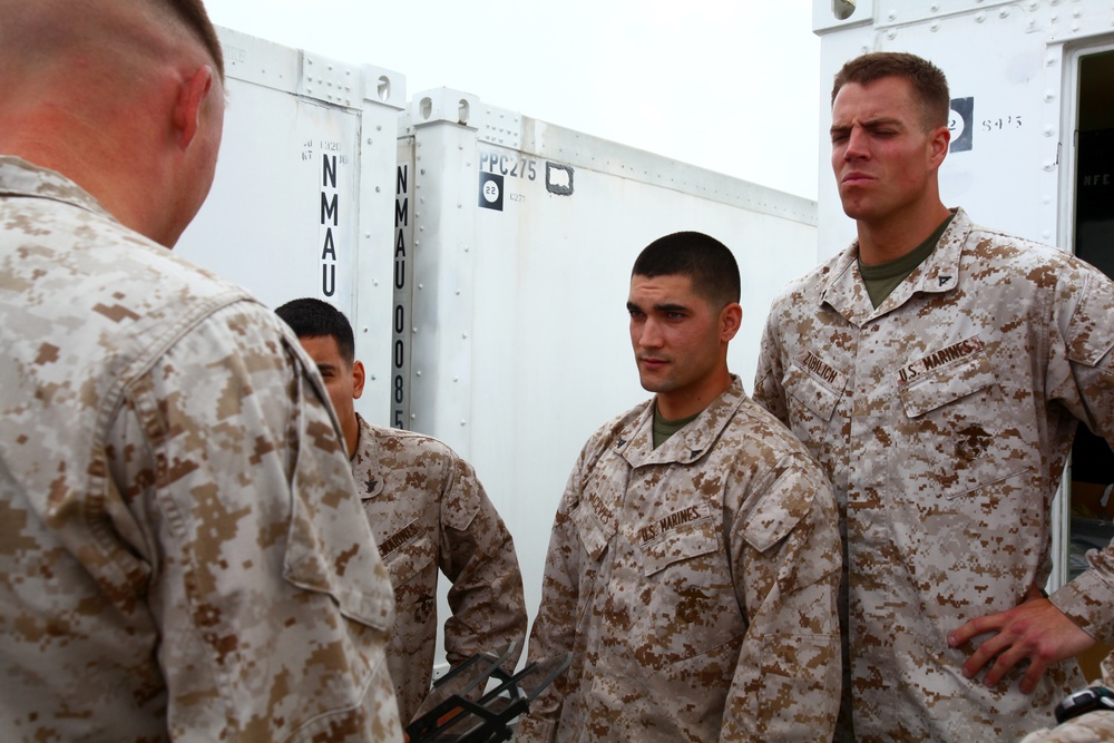 Three stripes up, crossed rifles in center: sergeants keep Corps tough