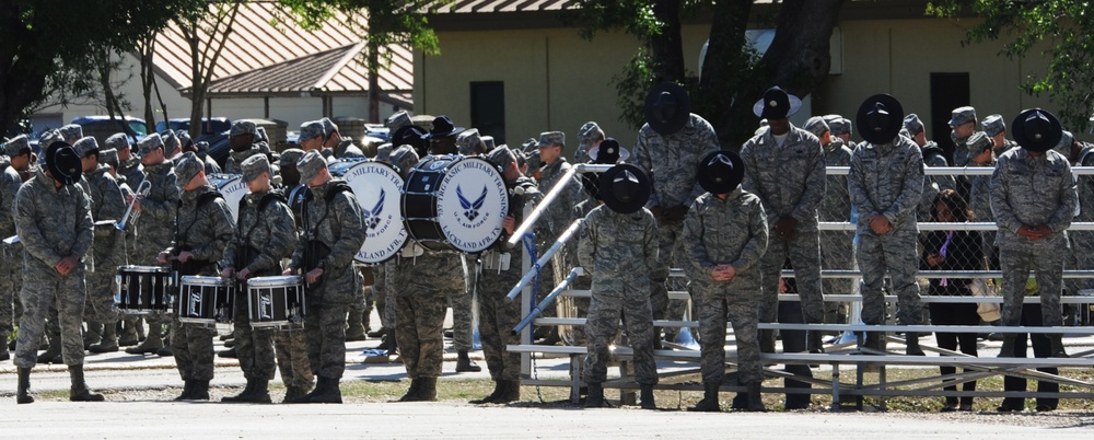 MTI's bow their heads during BMT Coin Ceremony