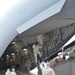 Army and Air National Guard members loading HC-60 Black Hawk on board a C-17