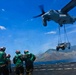 Pilots conduct first external lift from USNS Sacagawea