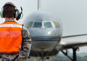 Follow Me: Yokota airmen assist transitory aircraft on the move