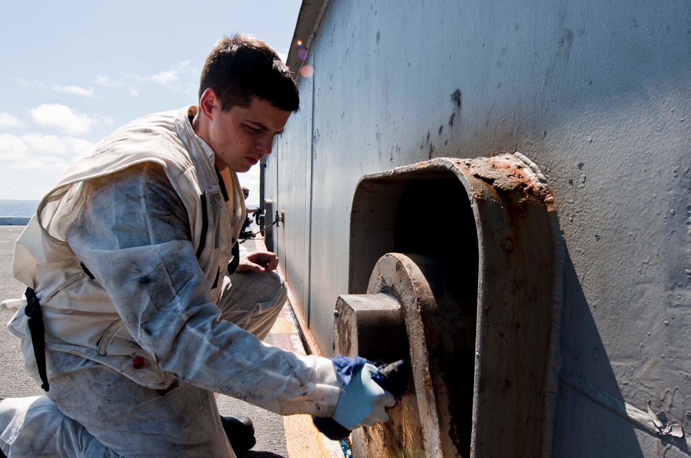 USS John C. Stennis sailors perform maintenance