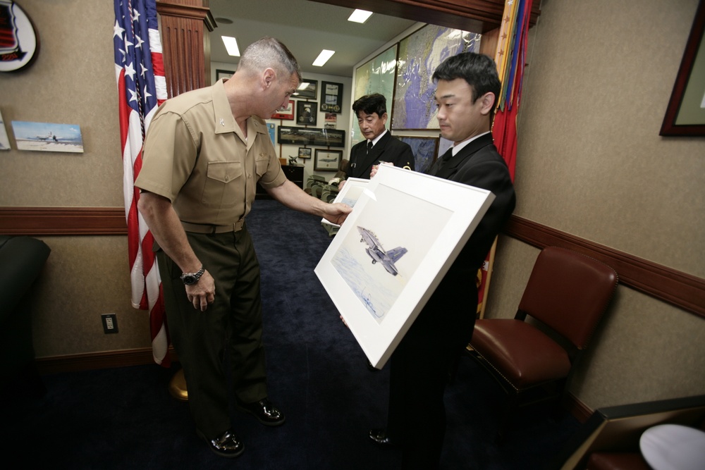 Marine Aircraft Group 12 receives paintings from local artist
