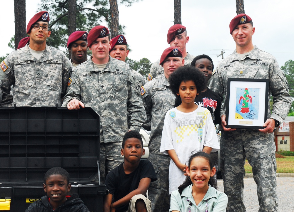 XVIII Airborne Corps paratroopers donate to local school