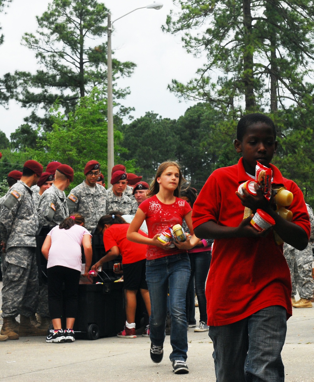 XVIII Airborne Corps paratroopers donate to local school