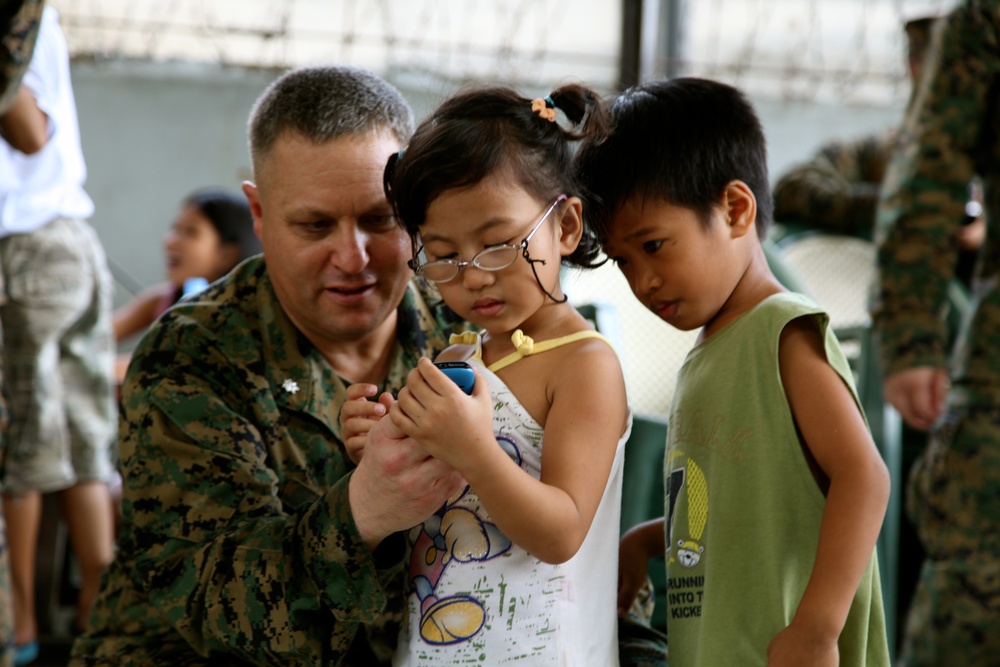 Philippines, US service members are ‘shoulder-to-shoulder’ in visit to orphanage