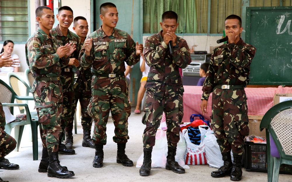 Philippines, US service members are ‘shoulder-to-shoulder’ in visit to orphanage