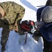 Marines ice fish with Alaskan natives