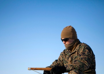 Marines ice fish with Alaskan natives