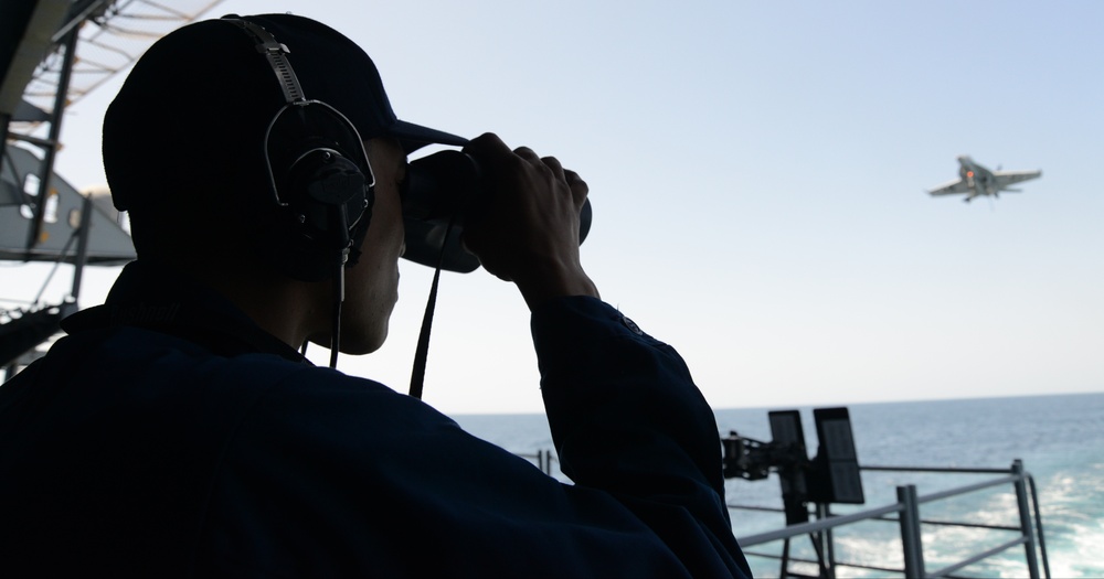 USS George HW Bush sailors at work