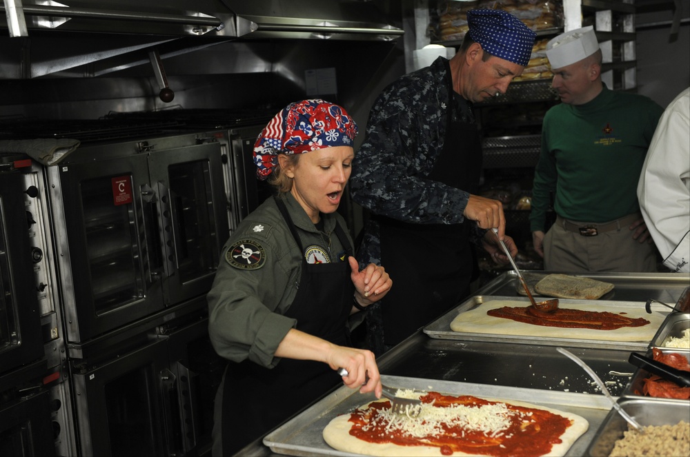 Officers prepare pizza
