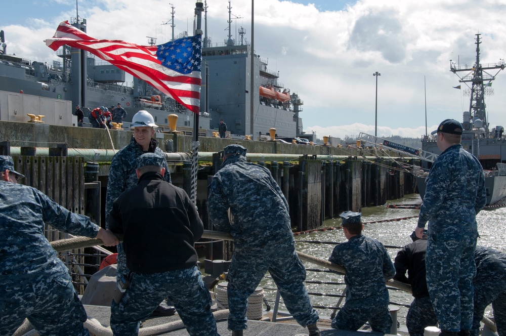USS Ford sailors heave a line