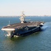 The aircraft carrier USS Dwight D. Eisenhower (CVN 69) makes its approach pierside at Naval Station Norfolk after a six-month deployment to the U.S. 5th and 6th Fleet areas of responsibility in support of Operation Enduring Freedom, maritime security oper