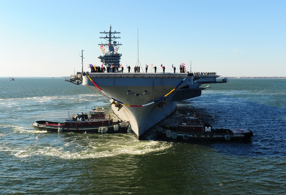 The aircraft carrier USS Dwight D. Eisenhower (CVN 69) makes its approach pierside at Naval Station Norfolk after a six-month deployment to the U.S. 5th and 6th Fleet areas of responsibility in support of Operation Enduring Freedom, maritime security oper