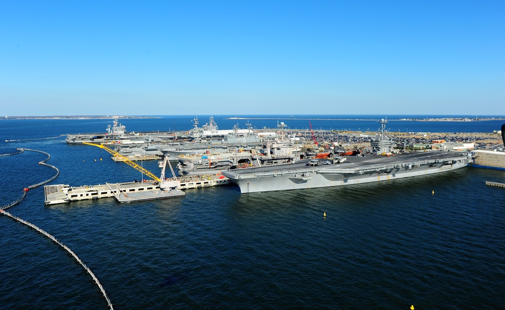 The aircraft carrier USS Dwight D. Eisenhower (CVN 69) makes its approach pierside at Naval Station Norfolk after a six-month deployment to the U.S. 5th and 6th Fleet areas of responsibility in support of Operation Enduring Freedom, maritime security oper