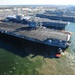 The aircraft carrier USS Dwight D. Eisenhower (CVN 69) makes its approach pierside at Naval Station Norfolk after a six-month deployment to the U.S. 5th and 6th Fleet areas of responsibility in support of Operation Enduring Freedom, maritime security oper