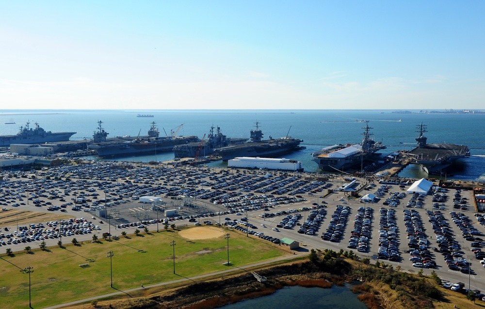 The aircraft carrier USS Dwight D. Eisenhower (CVN 69) makes its approach pierside at Naval Station Norfolk after a six-month deployment to the U.S. 5th and 6th Fleet areas of responsibility in support of Operation Enduring Freedom, maritime security oper