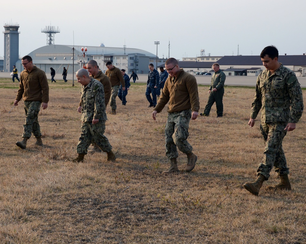 Misawa sailors participate in a base-wide FOD walk down