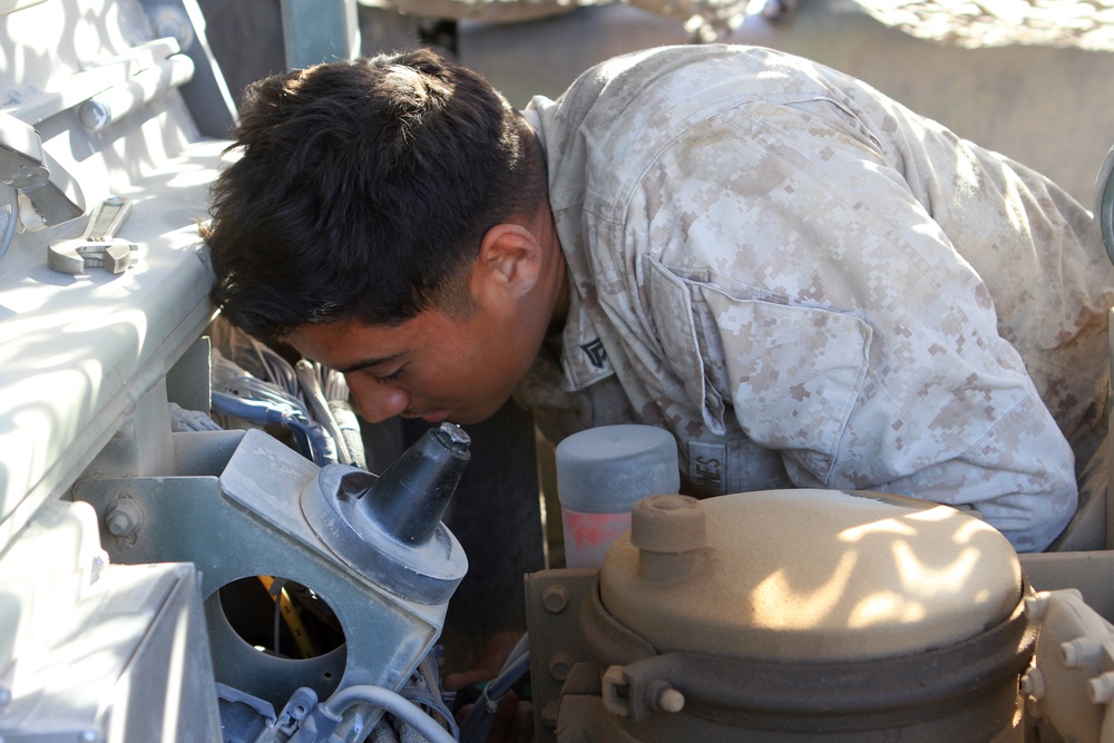 Marine mechanic single-handedly maintains battery vehicles