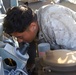 Marine mechanic single-handedly maintains battery vehicles