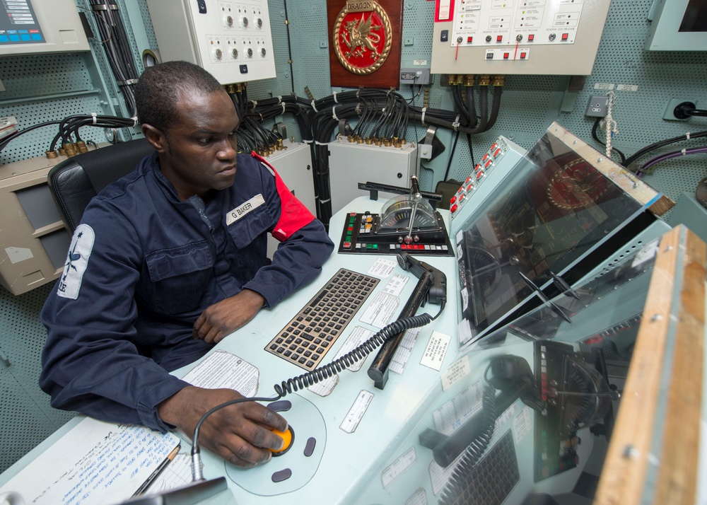 HMS Dragon sailor at work