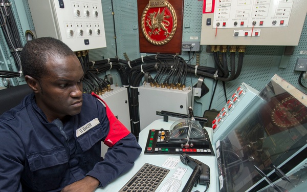 HMS Dragon sailor at work