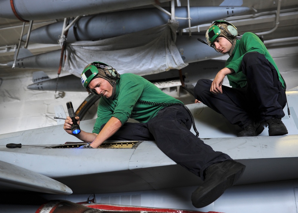 Sailors inspect control unit