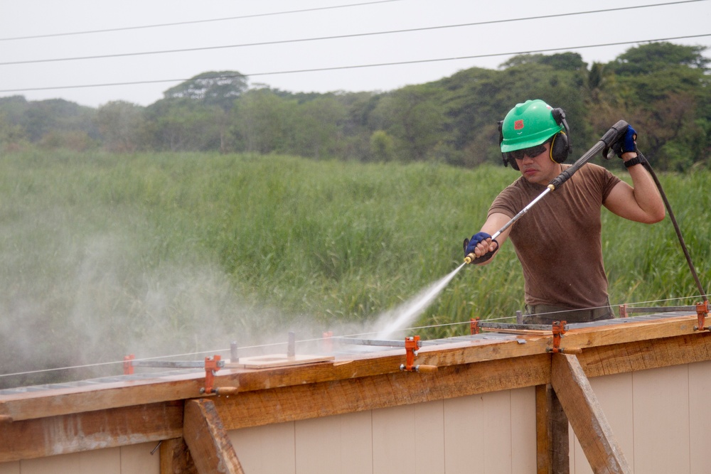 US, Chilean, Colombian and Salvadoran Engineers work together to build schoolhouse