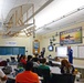 Members of Navy Flight Demonstration Squadron talk to aviation students