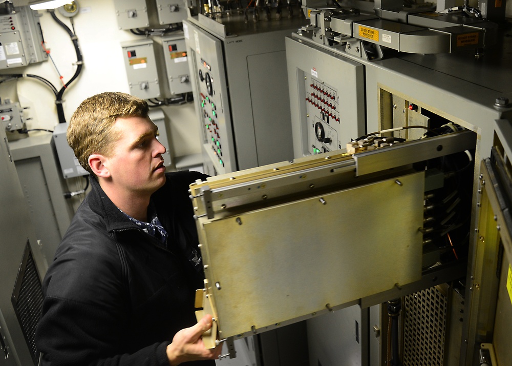 USS Oscar Austin sailor at work