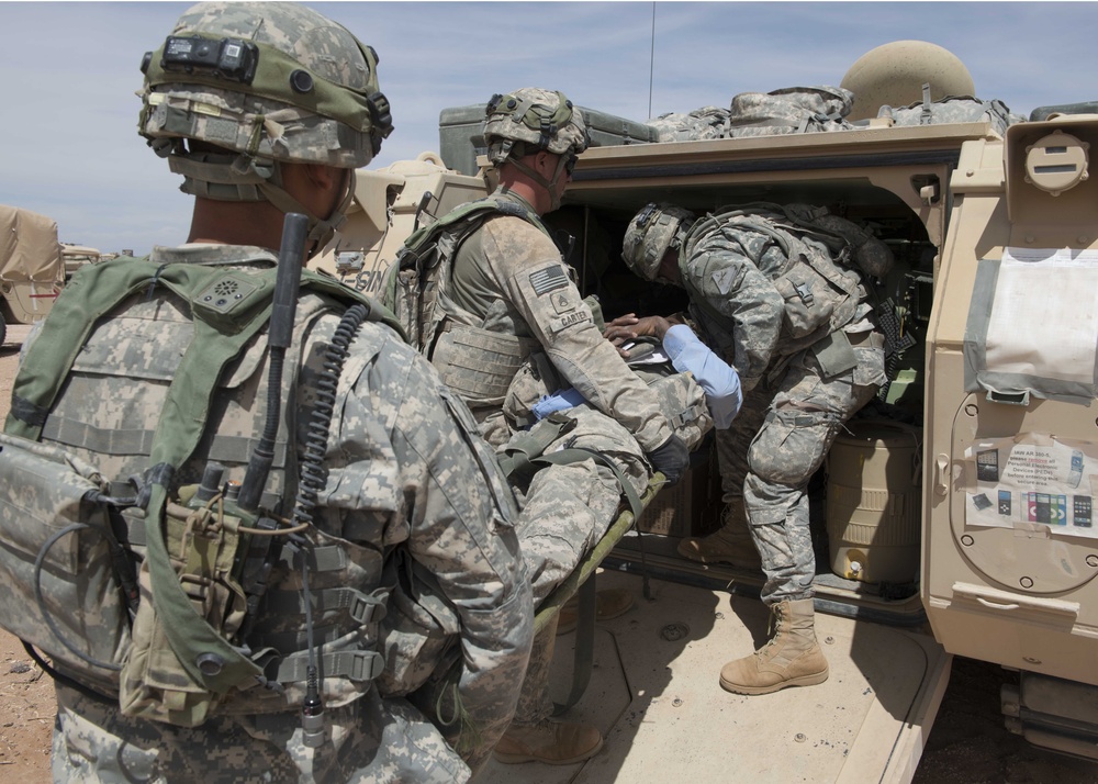 Soldiers with 1-6 Inf simulate evacuating injured refugees during NIE 13.2 near Dona Ana N.M.