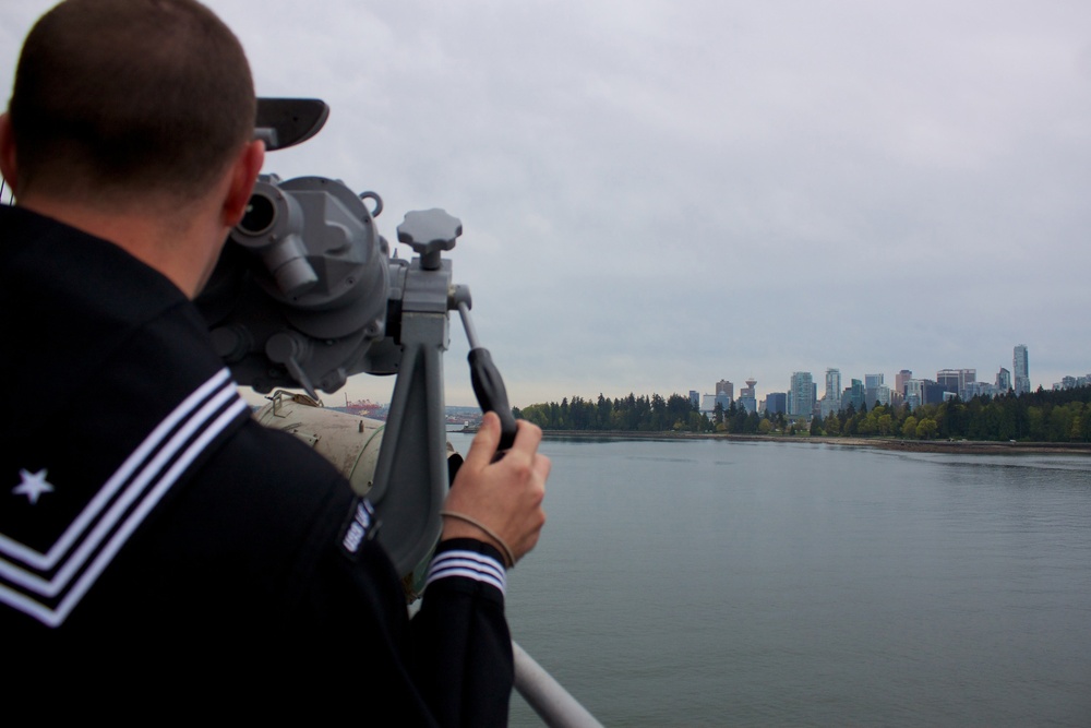 USS Lake Champlain sailor scans waters