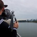 USS Lake Champlain sailor scans waters