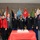 Oldest and youngest soldiers with distinguished visitors pose before the cake cutting