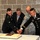 Oldest and youngest with Army Reserve ambassador cut the cake