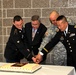Oldest and youngest with Army Reserve ambassador cut the cake
