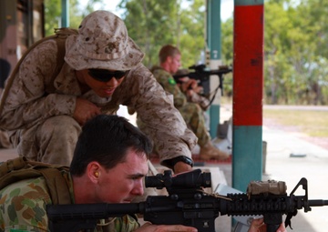 Marines and Australian soldiers aim to shoot each other’s weapons