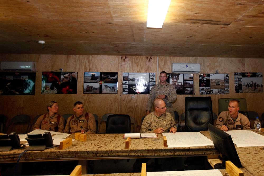 U.S. Navy Sailors work towards their Fleet Marine Force badge with the help of U.S. Marines