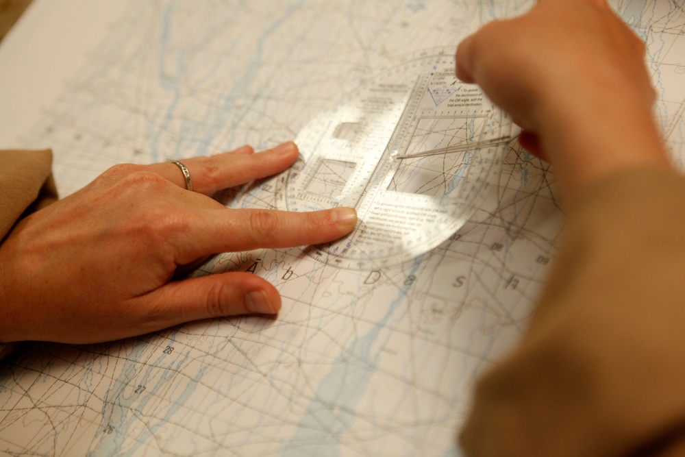 U.S. Navy Sailors work towards their Fleet Marine Force badge with the help of U.S. Marines