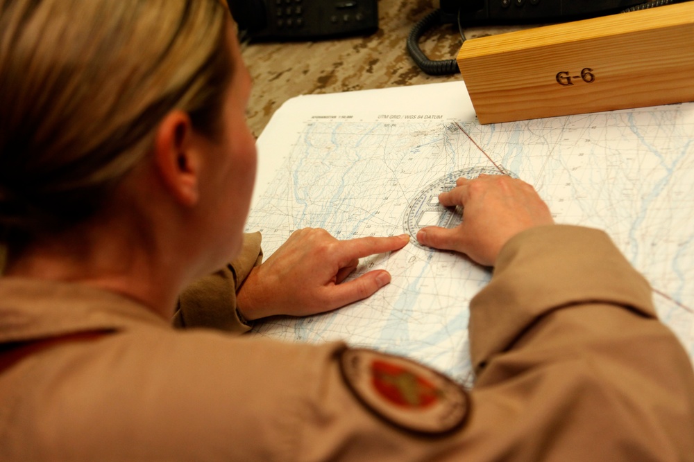 U.S. Navy Sailors work towards their Fleet Marine Force badge with the help of U.S. Marines