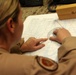 U.S. Navy Sailors work towards their Fleet Marine Force badge with the help of U.S. Marines