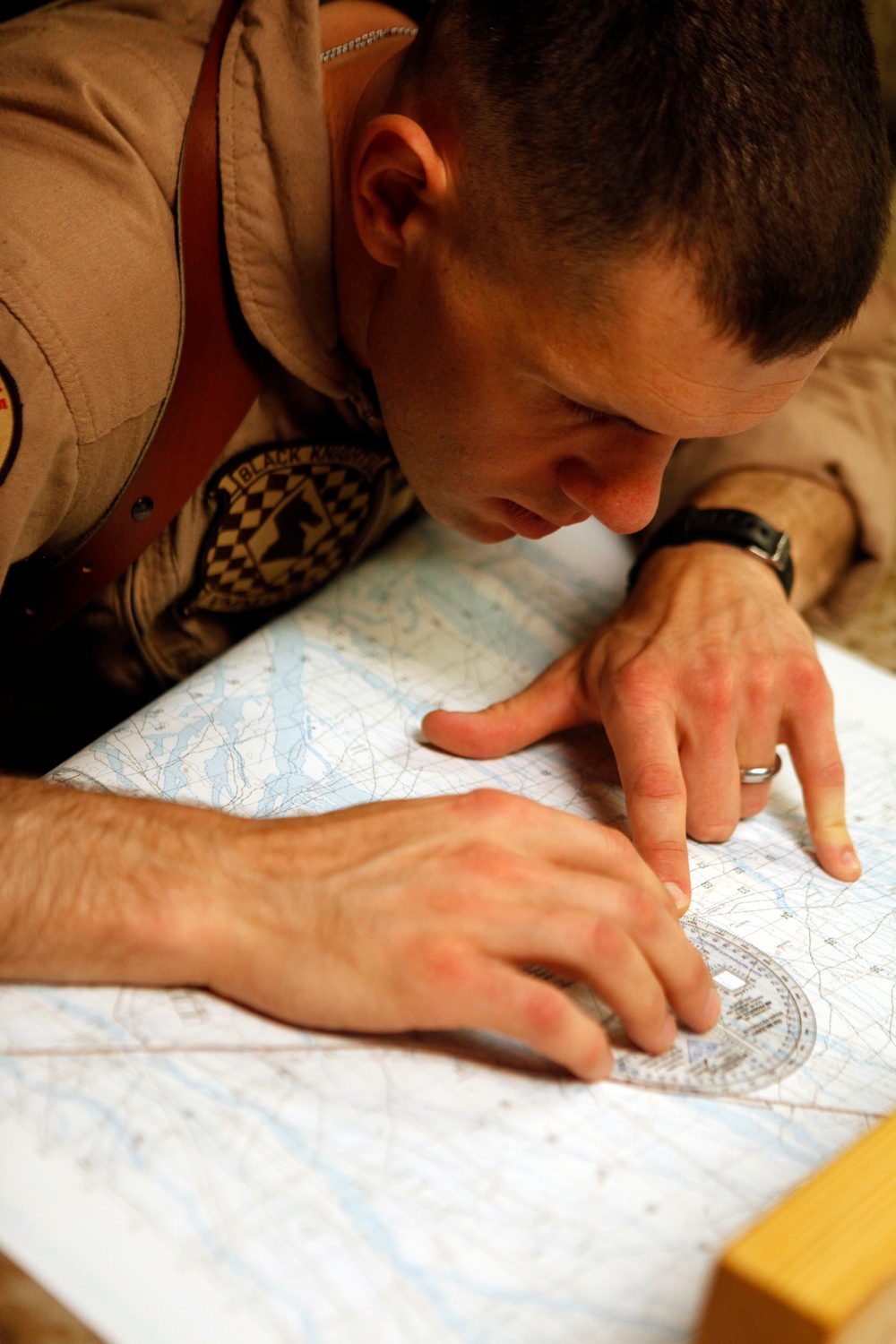 U.S. Navy Sailors work towards their Fleet Marine Force badge with the help of U.S. Marines