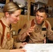 U.S. Navy Sailors work towards their Fleet Marine Force badge with the help of U.S. Marines