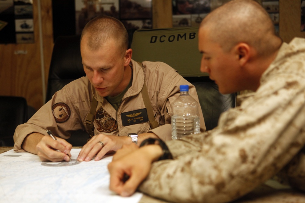 U.S. Navy Sailors work towards their Fleet Marine Force badge with the help of U.S. Marines