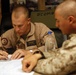 U.S. Navy Sailors work towards their Fleet Marine Force badge with the help of U.S. Marines