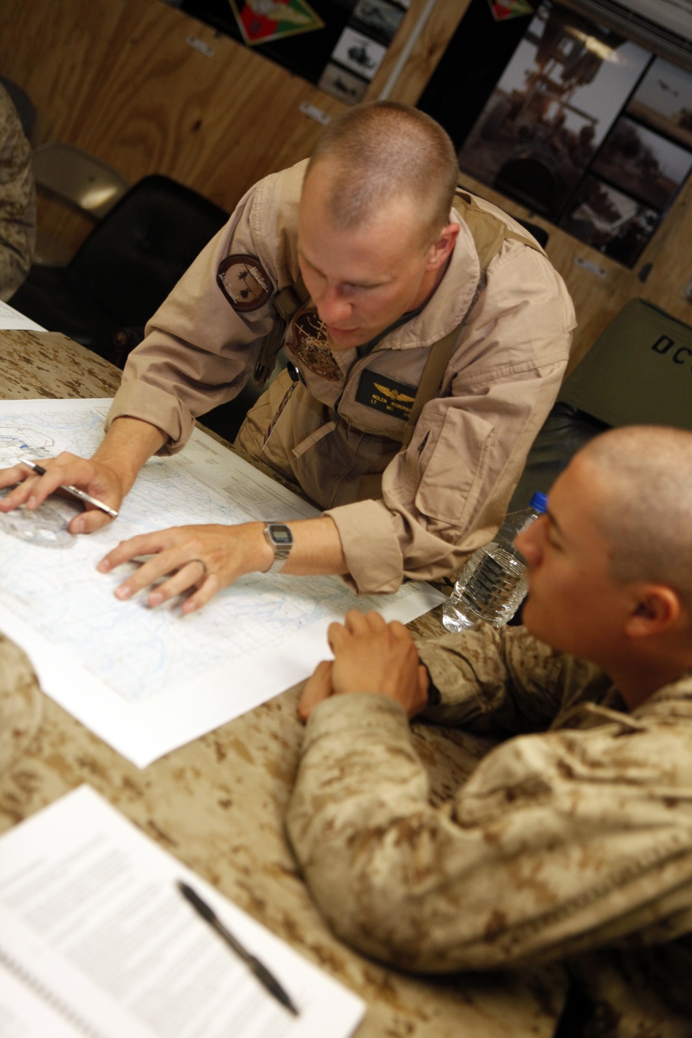 U.S. Navy Sailors work towards their Fleet Marine Force badge with the help of U.S. Marines