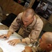 U.S. Navy Sailors work towards their Fleet Marine Force badge with the help of U.S. Marines