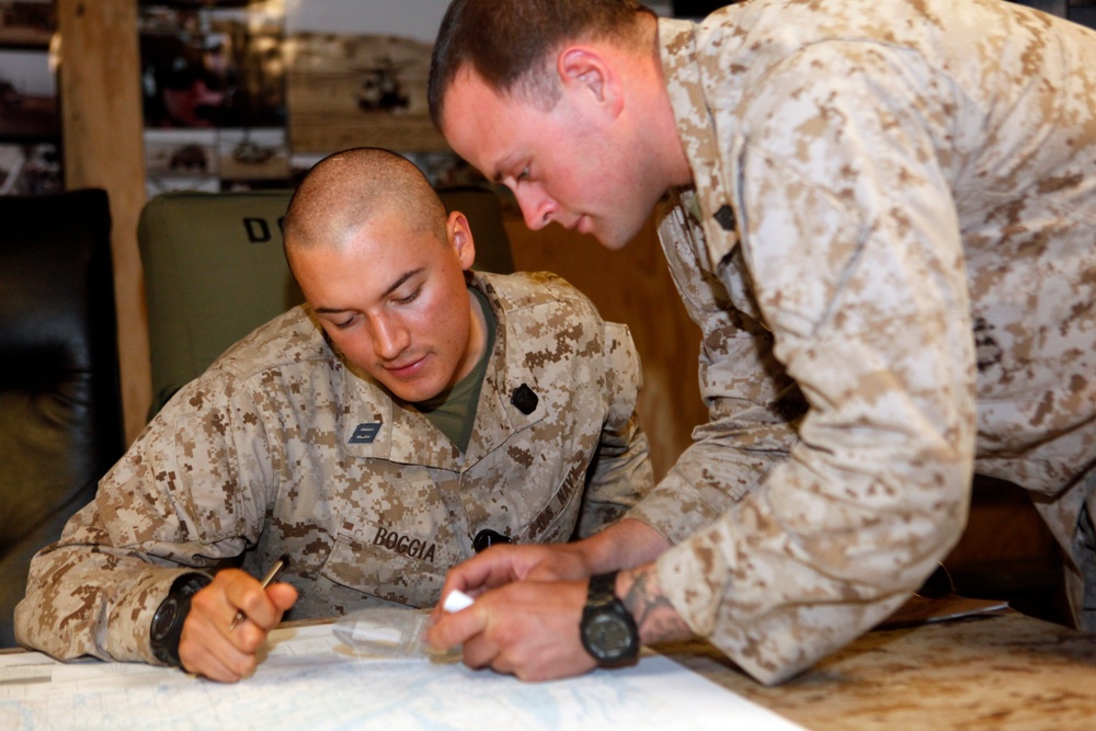 U.S. Navy Sailors work towards their Fleet Marine Force badge with the help of U.S. Marines