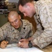 U.S. Navy Sailors work towards their Fleet Marine Force badge with the help of U.S. Marines