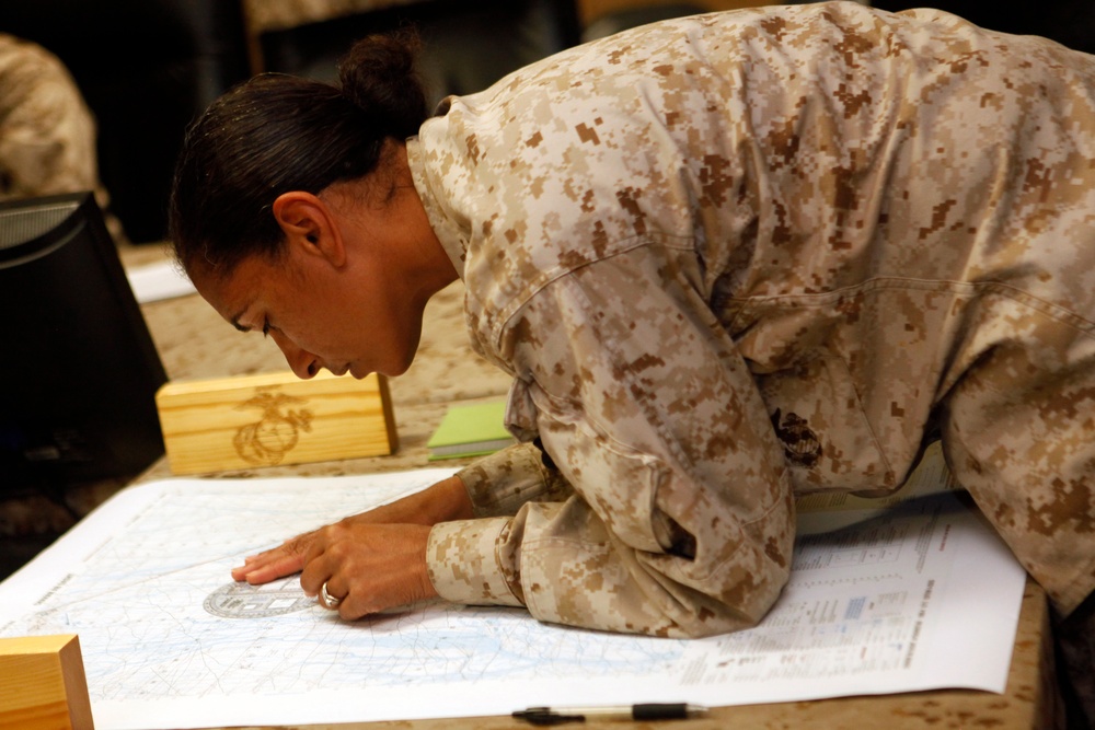 U.S. Navy Sailors work towards their Fleet Marine Force badge with the help of U.S. Marines